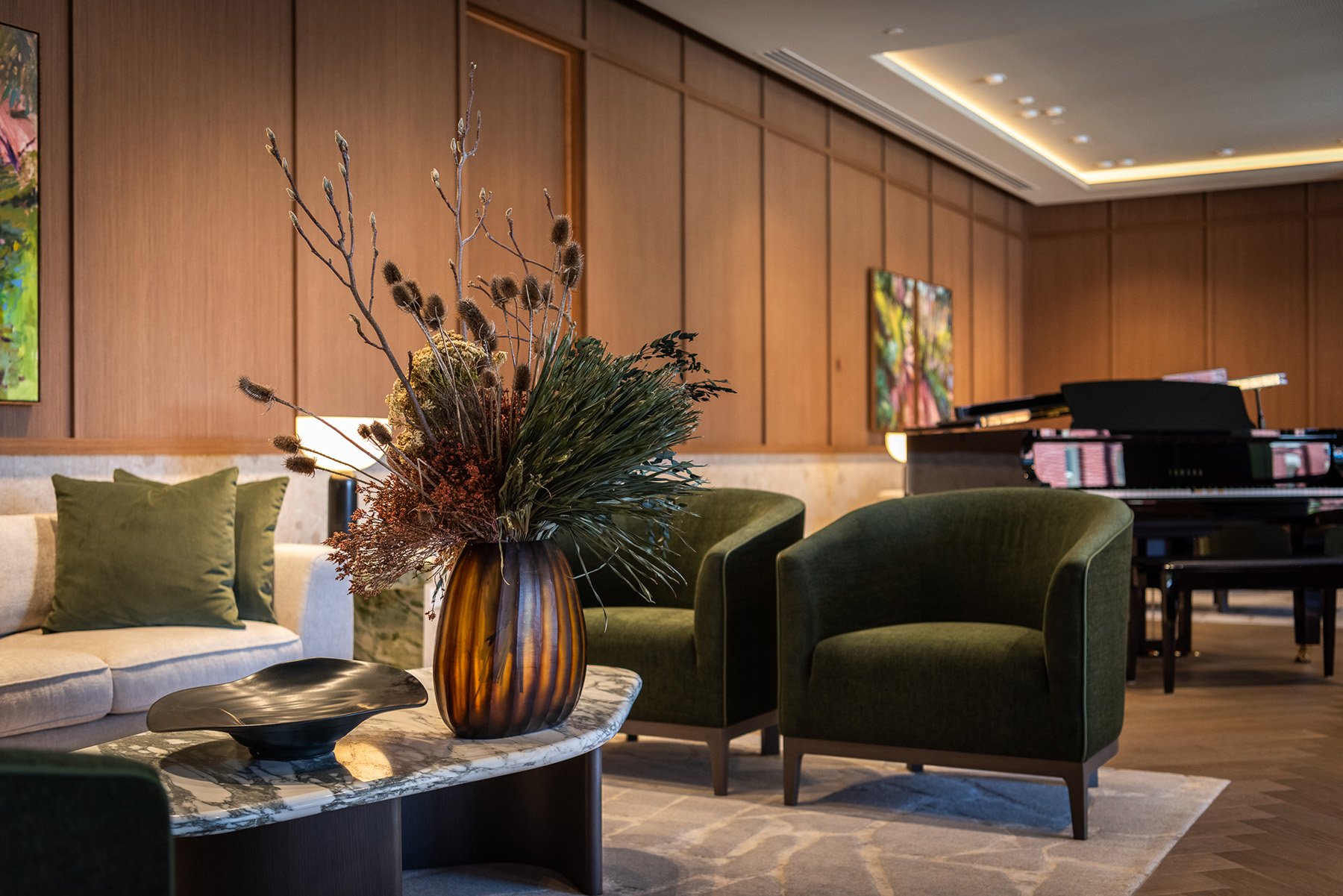 Flowers in front of green lounge chairs-1