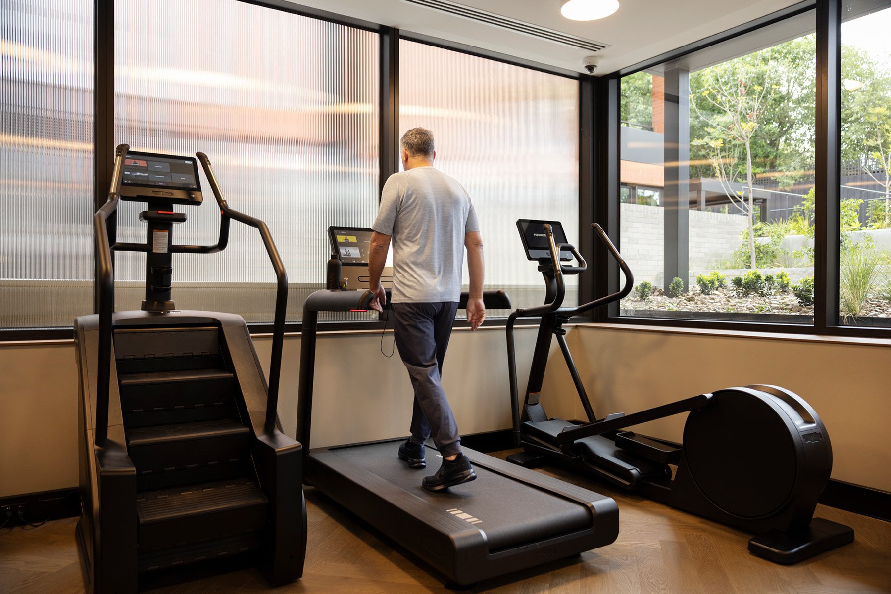 Man using treadmill in St. Clare gym