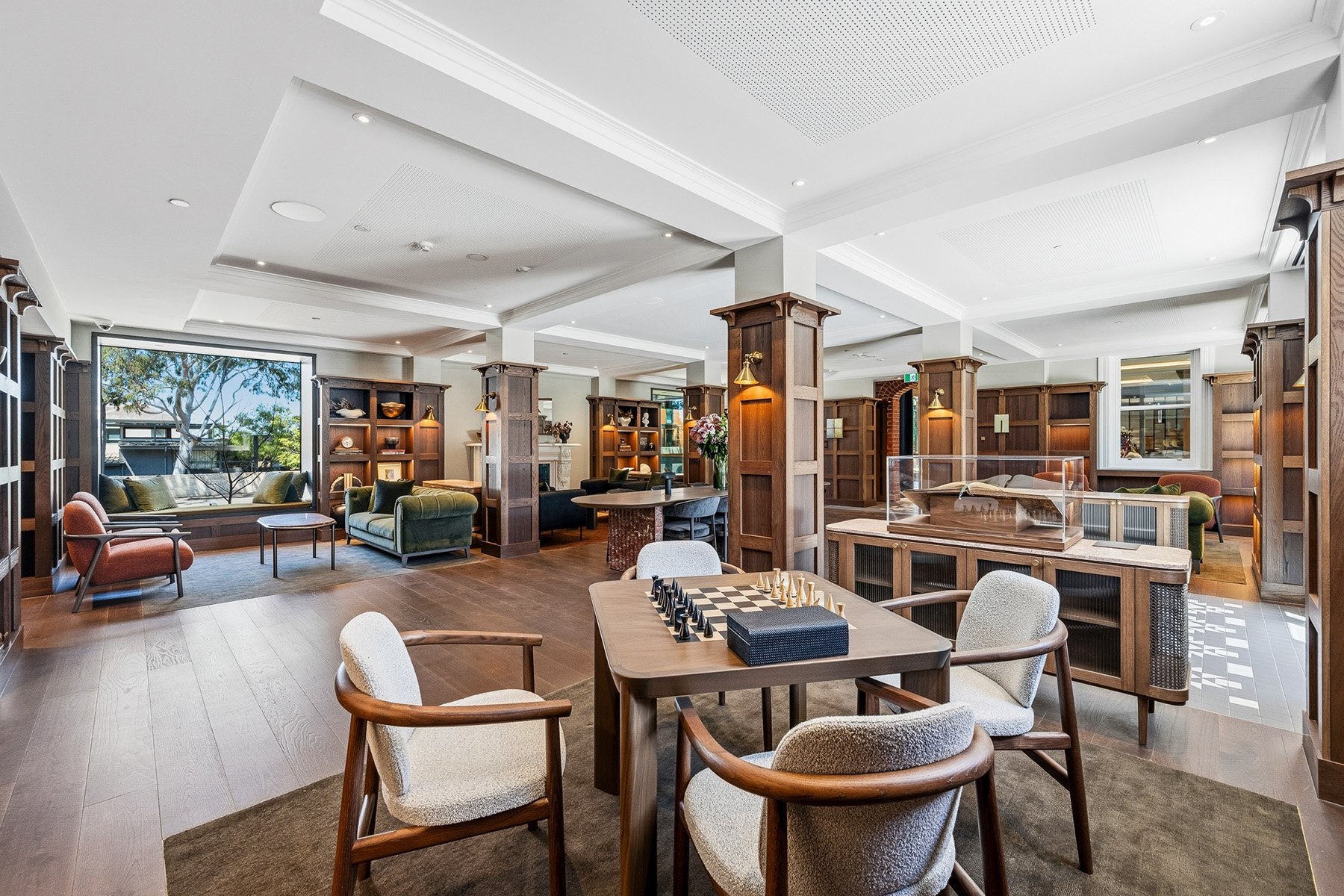 Table and chairs with chess set within St. Clare library