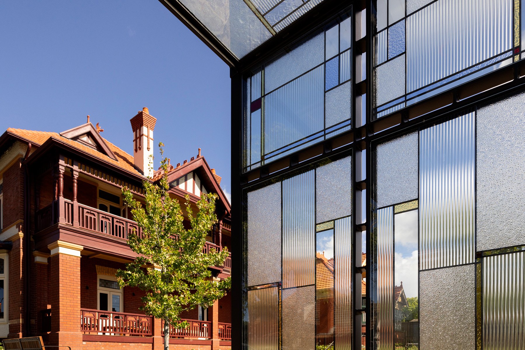 View through St. Clare entry arbor to heritage building Esmonde House